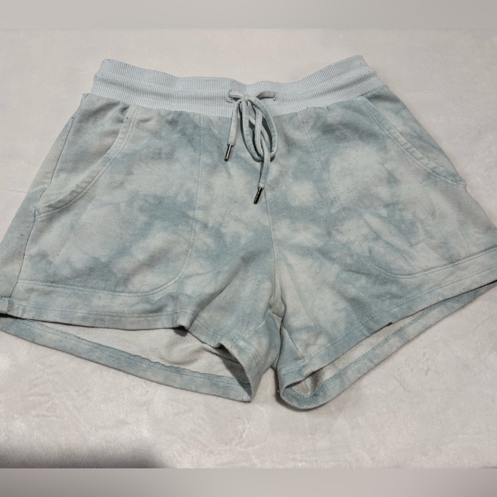 Stars above blue tie dye xsmall shorts